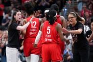 Caitlin Clark #22 and head coach Stephanie White of the Indiana Fever celebrate with Shey Peddy #5 in the fourth quarter against the Minnesota Lynx at Gainbridge Fieldhouse on August 22, 2025, in Indianapolis, Indiana. - Source: Getty